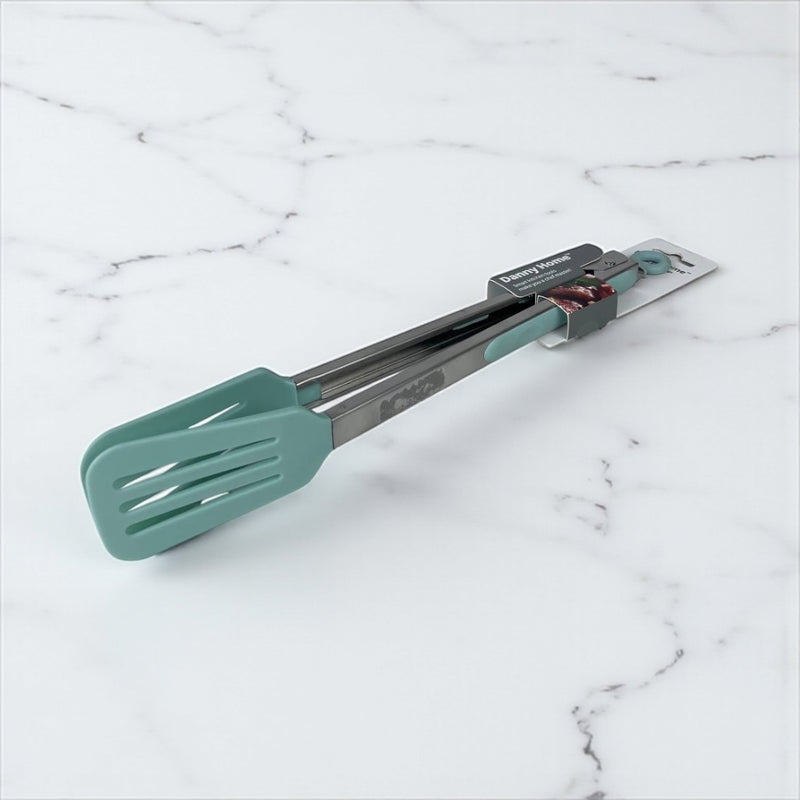 Teal spatula and tongs on a marble surface available at cupindy.com