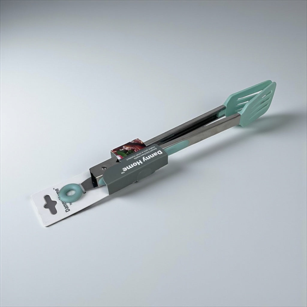 Multifunctional kitchen tool with green handle and black body on a light gray background available at cupindy.com