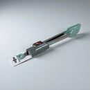 Multifunctional kitchen tool with green handle and black body on a light gray background available at cupindy.com