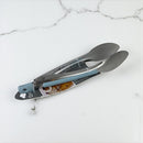Set of metal utensils on a white marble surface available at cupindy.com