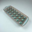 Mold with multiple small round cavities on a light gray background available at cupindy.com
