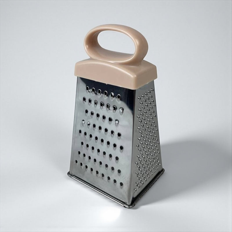 Box grater with a beige handle on a light gray background available at cupindy.com