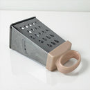 Box grater with a beige handle on a white background available at cupindy.com