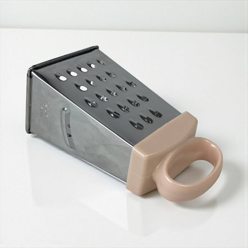 Box grater with a beige handle on a white background available at cupindy.com