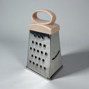 Box grater with a pink handle on a gray background available at cupindy.com