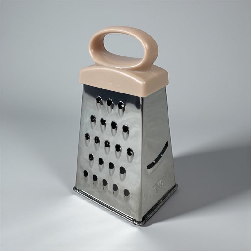 Box grater with a pink handle on a gray background available at cupindy.com