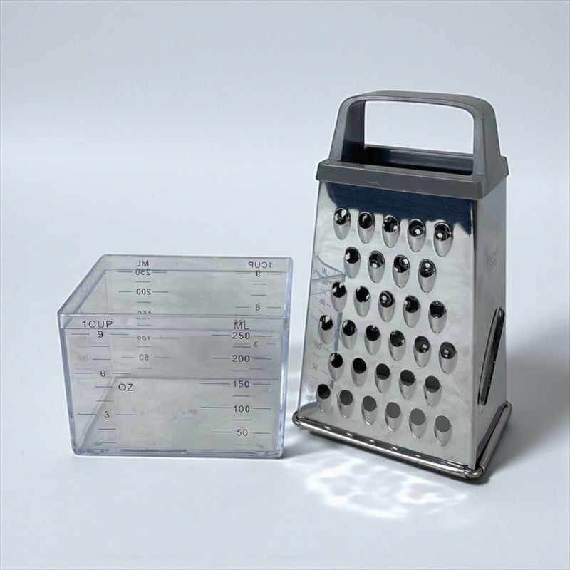 Box grater and measuring cup on a light gray background available at cupindy.com