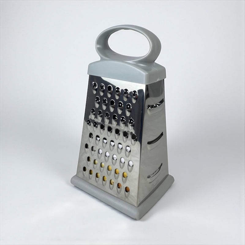Box grater with a silver metal surface and gray handle on a white background available at cupindy.com