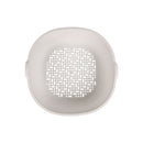 Round white object with a textured pattern on a white background