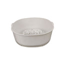 White plastic colander on a white background