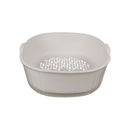 White plastic colander on a white background