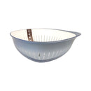 Blue colander with white interior on a white background