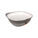 Gray colander with white interior on a white background
