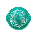 Turquoise colander with a starburst pattern on a white background