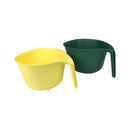 Yellow and green plastic containers on a white background