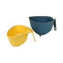 Yellow and blue plastic colanders on a white background