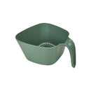 Green plastic colander with handle on a white background