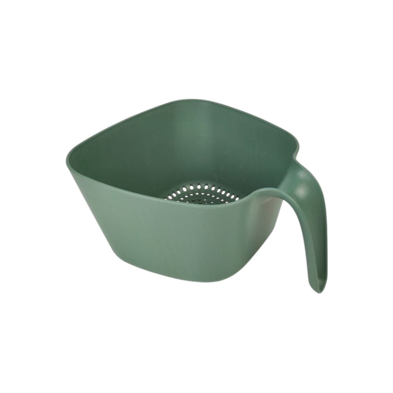 Green plastic colander with handle on a white background