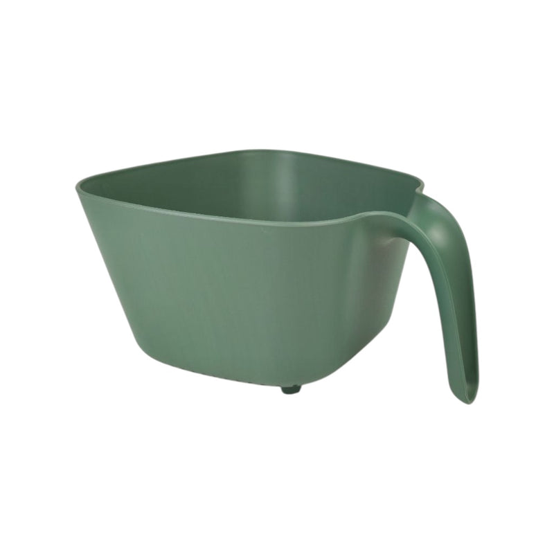 Green plastic measuring cup on a white background