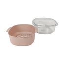 Pink ceramic pot with a clear lid on a white background