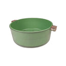 Green plastic basin with handles on a white background