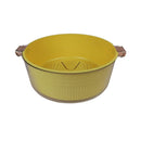 Yellow colander with handles on a white background