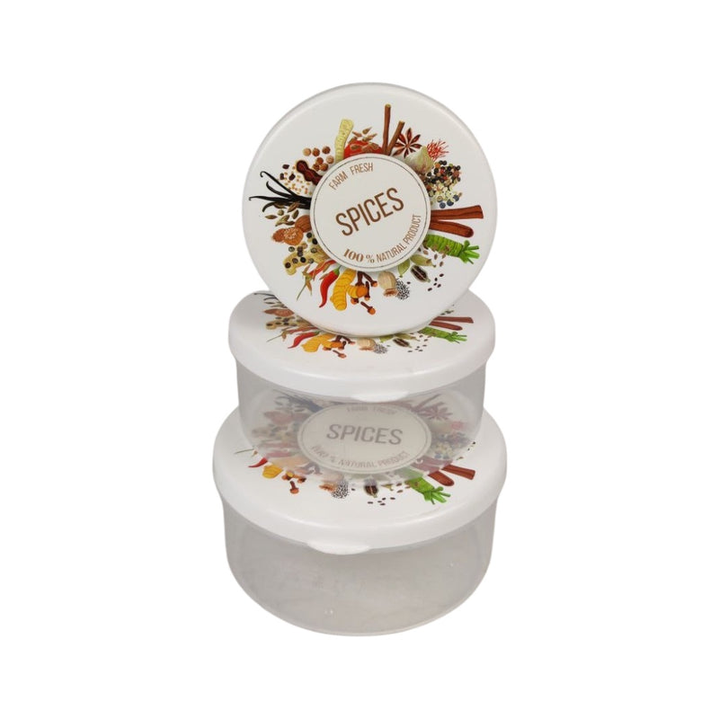 Stack of spice containers with decorative labels on a white background