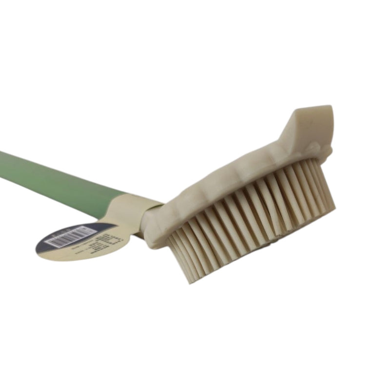 Beige brush with green handle on a white background