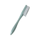 Light blue toothbrush with white bristles on a white background