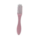 Pink hairbrush with a white bristle head on a white background