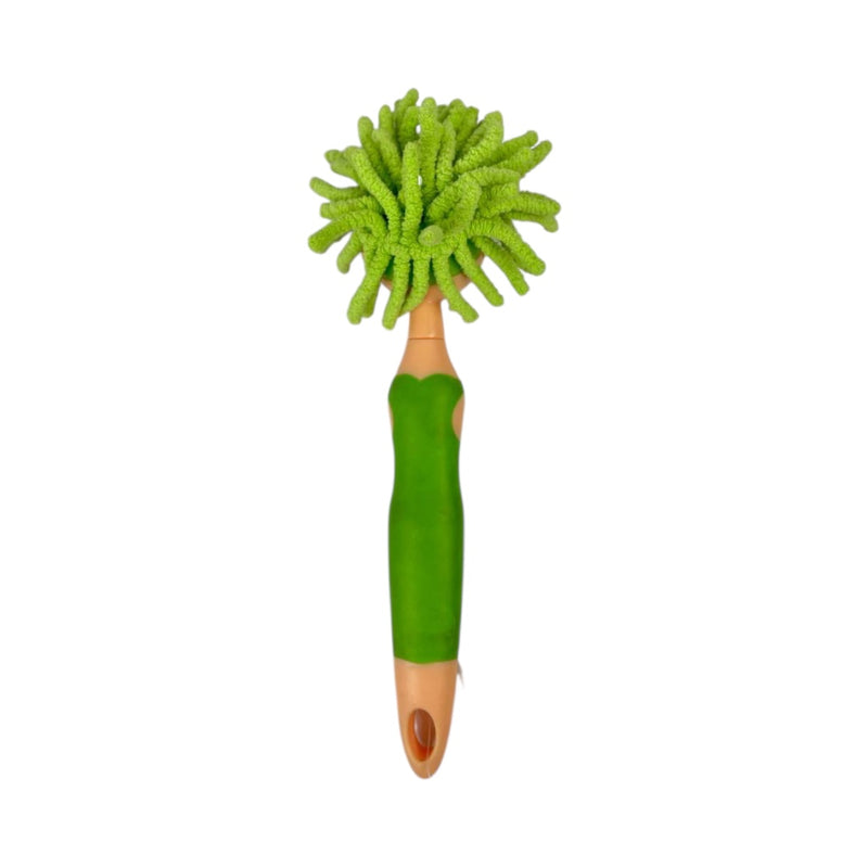 Green cleaning brush with a handle on a white background