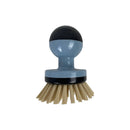 Cleaning brush with blue handle and black bristles on a white background