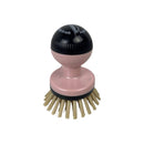 Pink brush with black handle on a white background