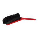 Red brush with black bristles on a white background