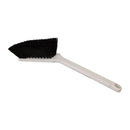 Cleaning brush with black bristle head and white handle on a white background