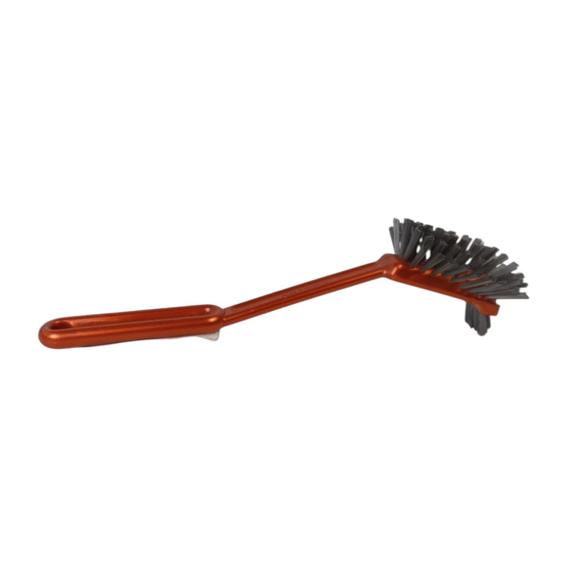 Cleaning brush with red handle and black bristles on a white background
