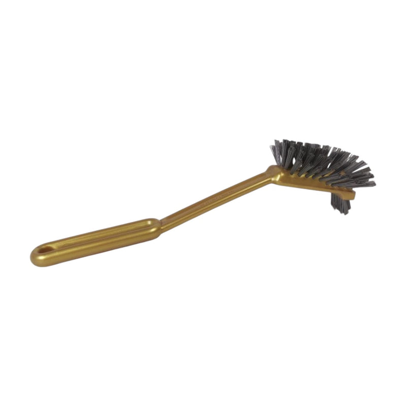 Gold brush with black bristles on a white background