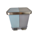Two-toned trash bin with metallic lid on a white background