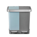 Two-toned trash bin with light blue and gray sections on a white background