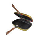 Open grill pan with wooden handle on a white background
