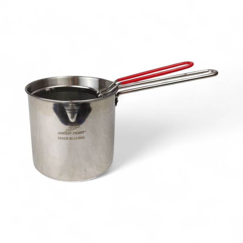 Stainless steel pot with red handle on a white background