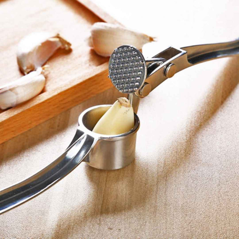 Kitchen garlic press for fine garlic mash without hassle | Cupindy