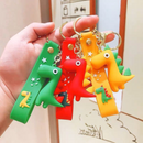 Colorful dinosaur keychains set - green, red, and yellow