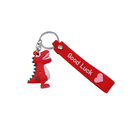 Stylish keychain featuring a red dinosaur and a positive message