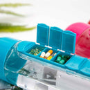 Blue pill organizer with assorted pills on a blurred natural background