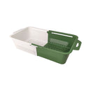Green and white plastic basket with a handle on a white background