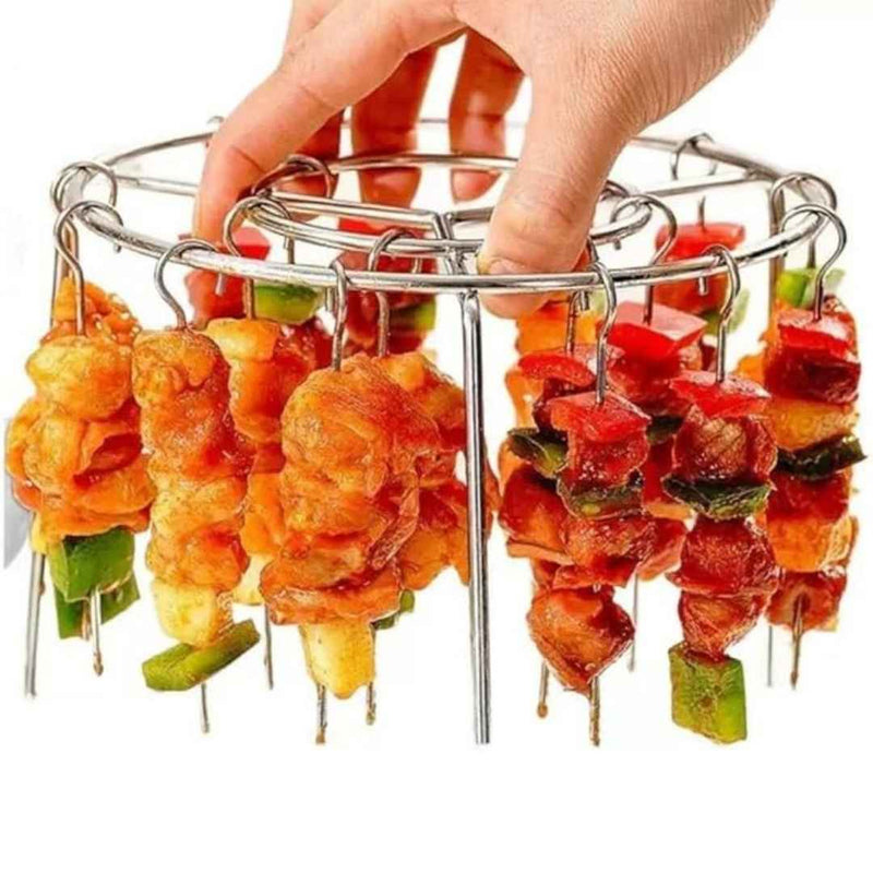 Metal skewer holder with skewered food items including chicken, pineapple, and bell peppers.