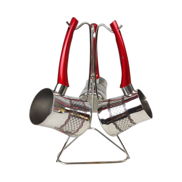 Set of three metal ladles with red handles on a white background