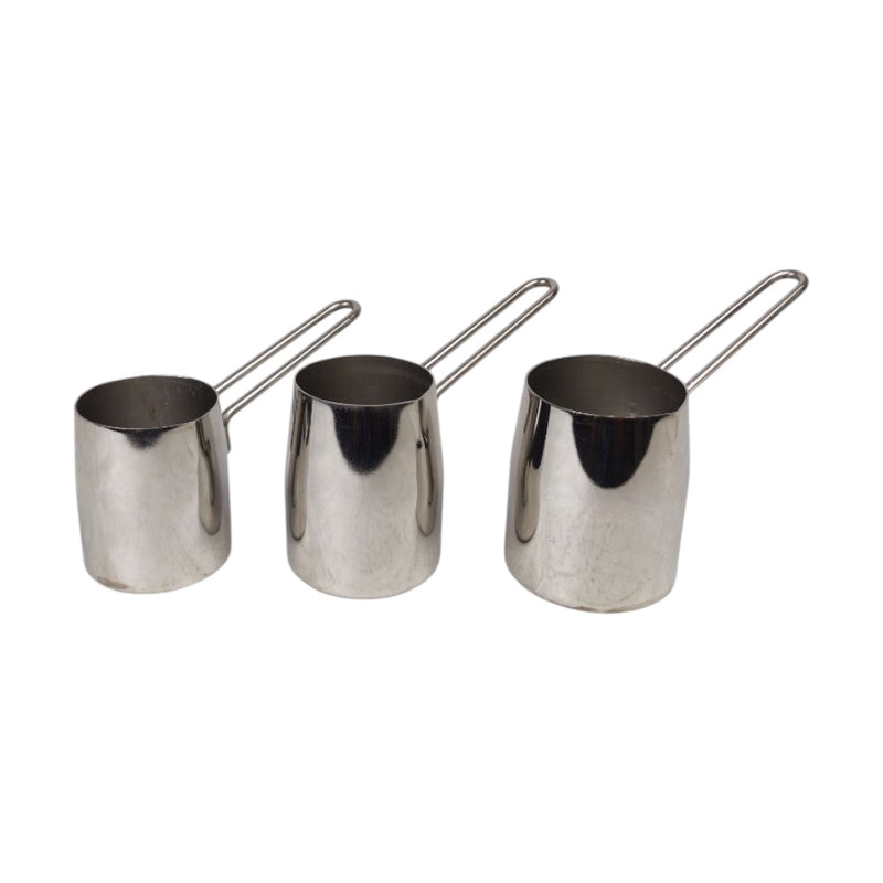 Three stainless steel milk pitchers with handles on a white background