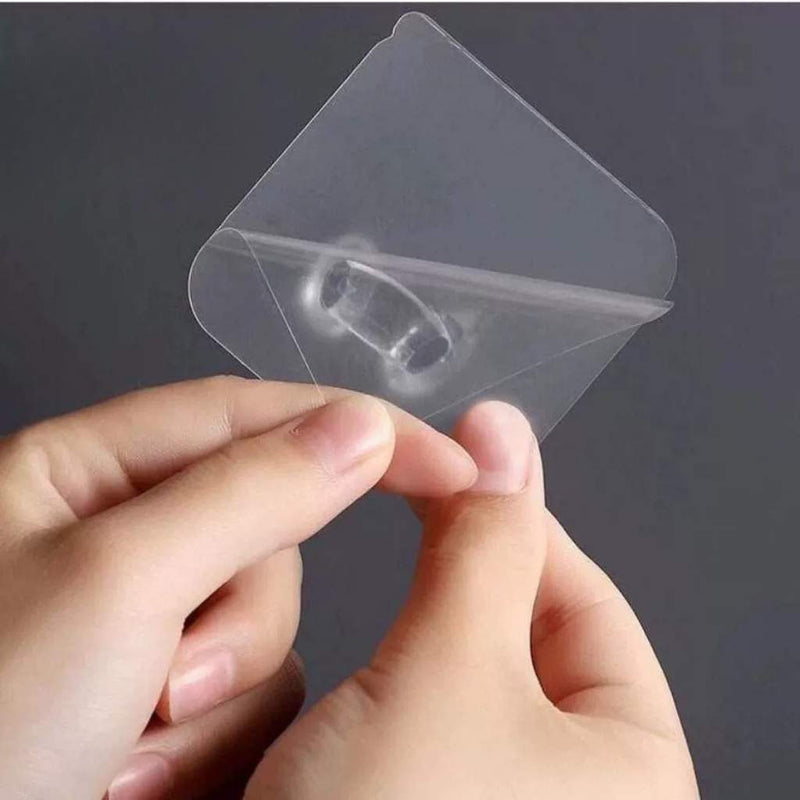 Transparent adhesive plug holder for keeping cords off the floor | Cupindy